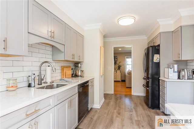 1516 N Indian Pl, North Brunswick, NJ 08902 - kitchen with freestanding refrigerator, stainless steel dishwasher, light wood-type flooring, decorative backsplash, and ornamental molding