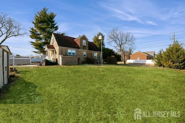 view of yard with fence