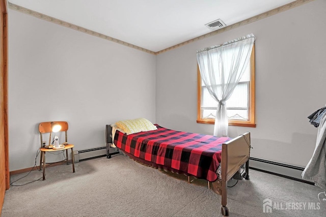 bedroom featuring carpet floors, visible vents, and baseboard heating