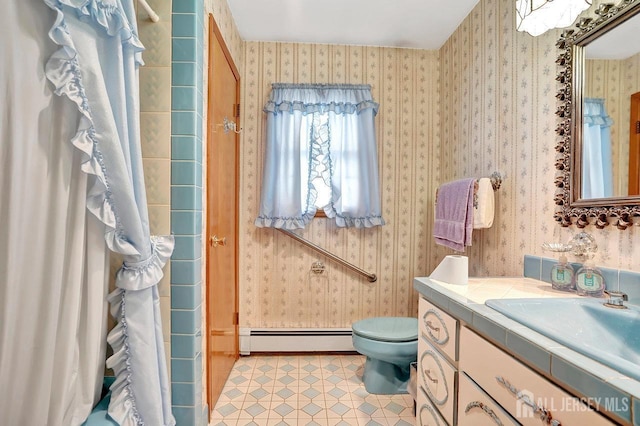 bathroom with a baseboard heating unit, toilet, and wallpapered walls