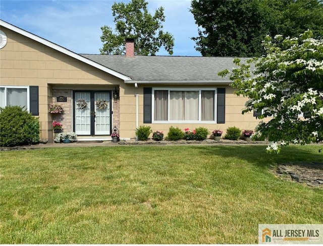 8 N Rhoda St, Monroe, NJ 08831 - single story home featuring a chimney, a front lawn, french doors, and roof with shingles