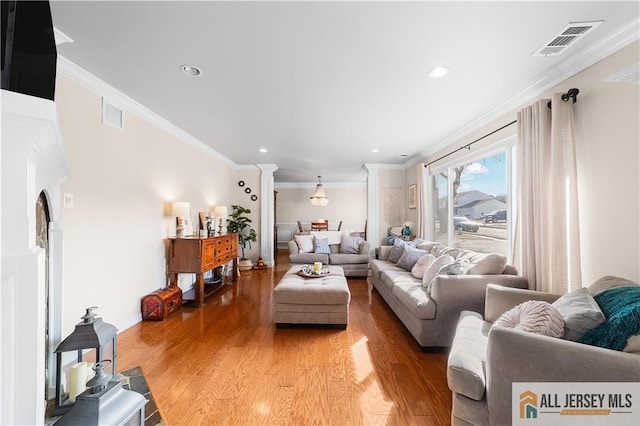 8 N Rhoda St, Monroe, NJ 08831 - living area with ornate columns, light wood finished floors, crown molding, and recessed lighting