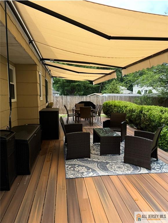 8 N Rhoda St, Monroe, NJ 08831 - deck with outdoor dining space, a fenced backyard, and outdoor lounge area