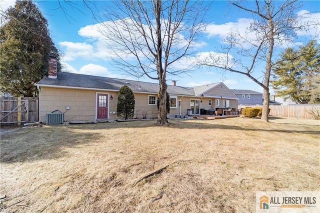 8 N Rhoda St, Monroe, NJ 08831 - rear view of house with central AC unit and a chimney