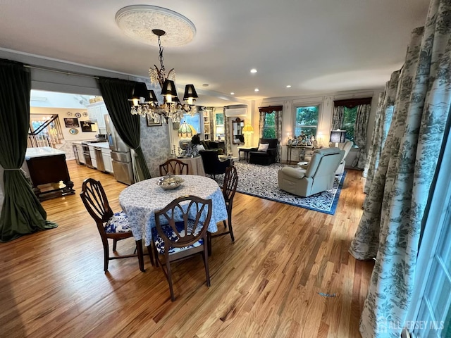 520 Albermarle St, Rahway, NJ 07065 - dining room with a chandelier, light wood-style flooring, a wall unit AC, and recessed lighting