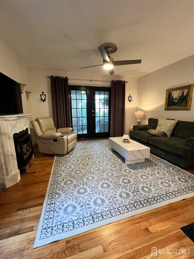 520 Albermarle St, Rahway, NJ 07065 - living area featuring wood finished floors, ceiling fan, and a fireplace