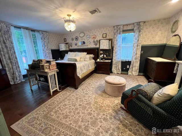520 Albermarle St, Rahway, NJ 07065 - bedroom with wallpapered walls, wood finished floors, and a chandelier