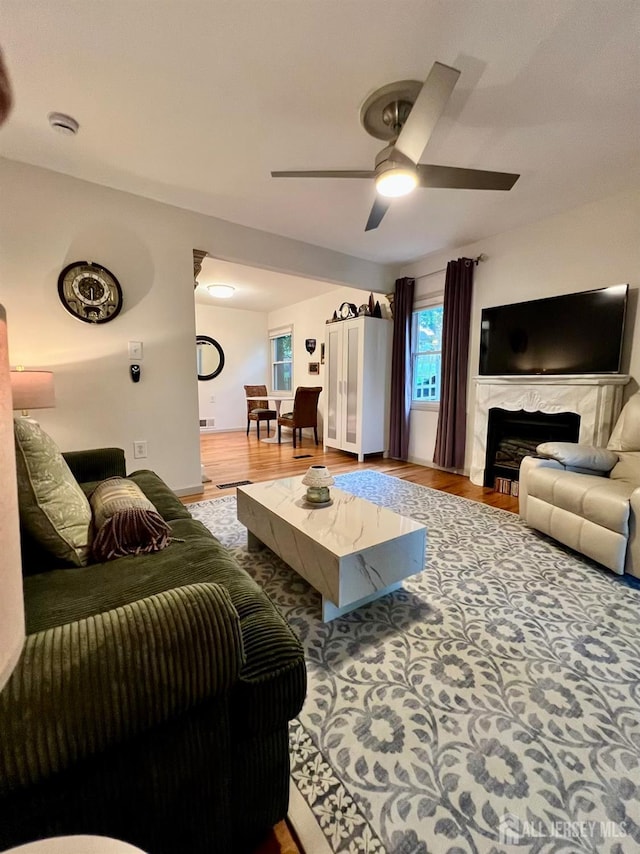520 Albermarle St, Rahway, NJ 07065 - living area with wood finished floors, a ceiling fan, and a premium fireplace