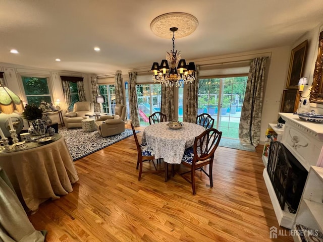 520 Albermarle St, Rahway, NJ 07065 - dining space with a chandelier, light wood-style flooring, recessed lighting, and a fireplace