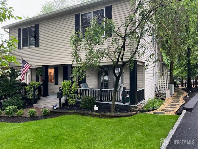 520 Albermarle St, Rahway, NJ 07065 - colonial home featuring covered porch and a front lawn