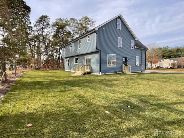 1032 3rd Ave, Manchester, NJ 08757 - rear view of property featuring a lawn