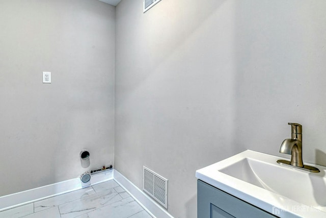 1032 3rd Ave, Manchester, NJ 08757 - laundry room with baseboards and marble look tiles