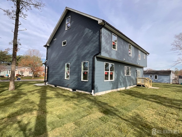 1032 3rd Ave, Manchester, NJ 08757 - back of house featuring a lawn