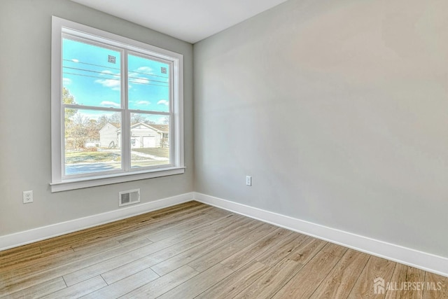 1032 3rd Ave, Manchester, NJ 08757 - empty room featuring baseboards and light wood-style flooring