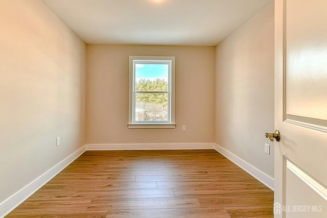 1032 3rd Ave, Manchester, NJ 08757 - empty room featuring wood finished floors and baseboards
