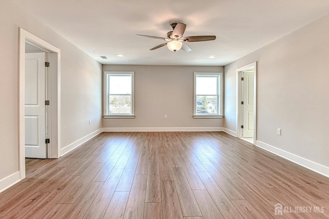 1032 3rd Ave, Manchester, NJ 08757 - empty room with plenty of natural light, a ceiling fan, and wood finished floors