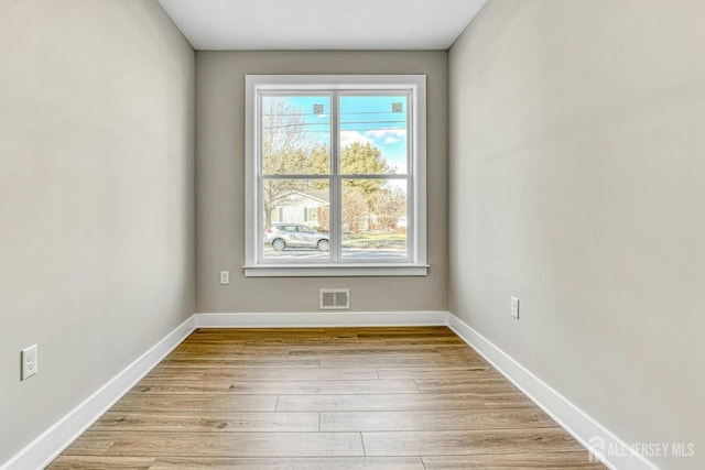 1032 3rd Ave, Manchester, NJ 08757 - spare room featuring light wood-style floors and baseboards