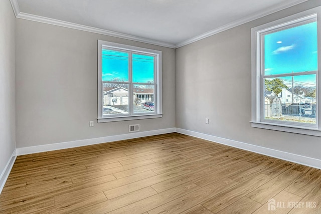 1032 3rd Ave, Manchester, NJ 08757 - unfurnished room with plenty of natural light, light wood-style floors, and crown molding