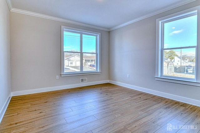 1032 3rd Ave, Manchester, NJ 08757 - spare room with ornamental molding, light wood-style floors, and baseboards