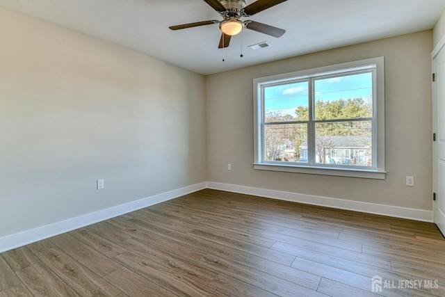 1032 3rd Ave, Manchester, NJ 08757 - unfurnished room with plenty of natural light, wood finished floors, and ceiling fan