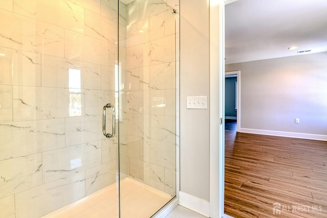 1032 3rd Ave, Manchester, NJ 08757 - full bathroom with baseboards, a stall shower, and wood finished floors