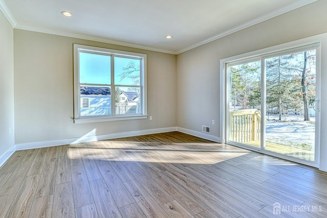 1032 3rd Ave, Manchester, NJ 08757 - unfurnished room featuring wood finished floors, ornamental molding, plenty of natural light, baseboards, and recessed lighting