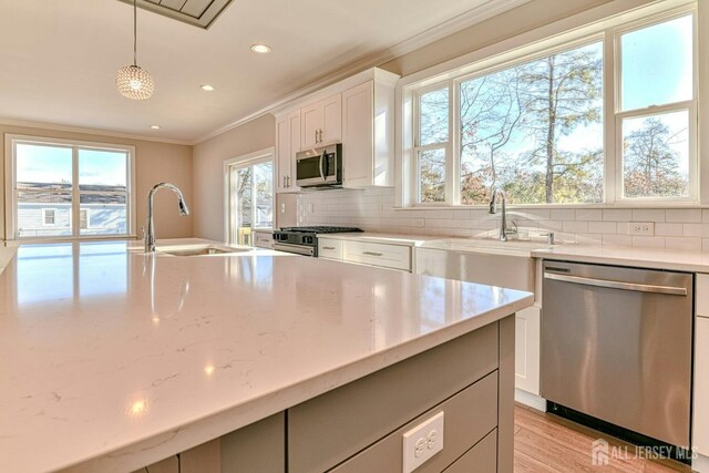 1032 3rd Ave, Manchester, NJ 08757 - kitchen featuring appliances with stainless steel finishes, a sink, ornamental molding, recessed lighting, and backsplash