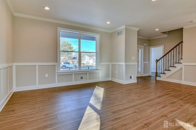 1032 3rd Ave, Manchester, NJ 08757 - empty room featuring wood finished floors, recessed lighting, stairway, and crown molding