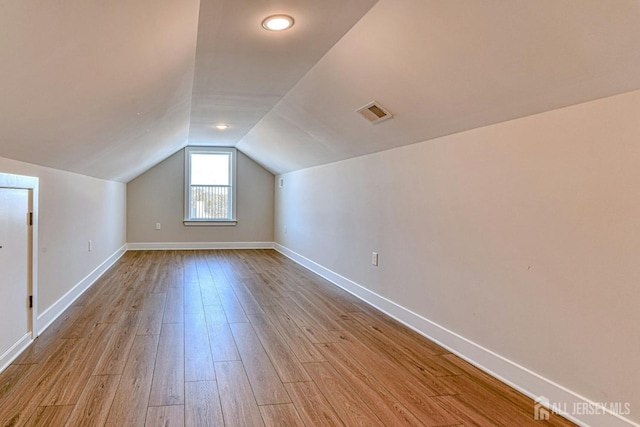 1032 3rd Ave, Manchester, NJ 08757 - bonus room with wood finished floors, vaulted ceiling, and baseboards