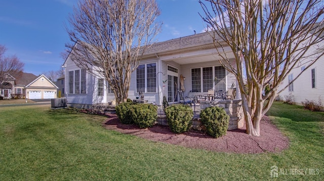 view of front of property featuring a front lawn and central air condition unit