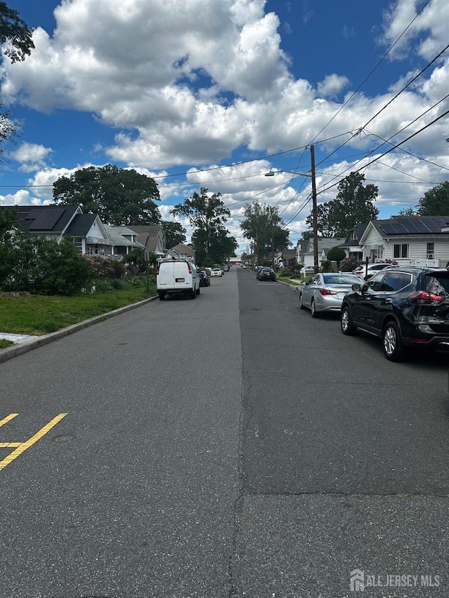 34 Livingston Ave, Avenel, NJ 07001 - view of asphalt street featuring a residential view and curbs