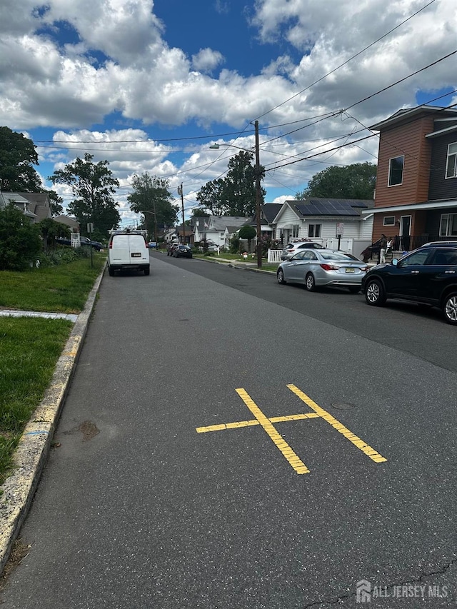 34 Livingston Ave, Avenel, NJ 07001 - view of asphalt road with curbs and a residential view