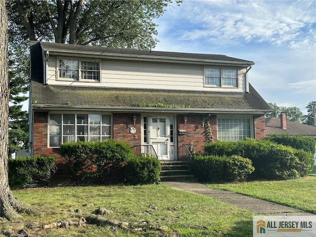 124 Dunbar Ave, Fords, NJ 08863 - traditional home featuring a front lawn and brick siding