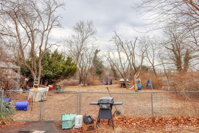 1205 Cherry St, South Plainfield, NJ 0708 - view of yard featuring a gate, fence, and a playground