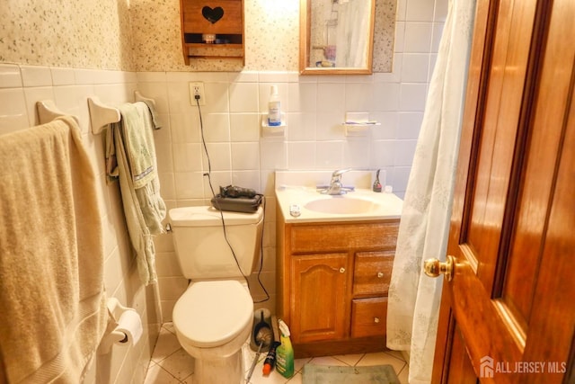1205 Cherry St, South Plainfield, NJ 0708 - bathroom featuring tile walls, toilet, vanity, wallpapered walls, and tile patterned flooring