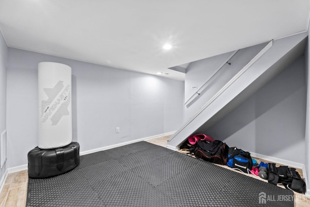 finished basement featuring baseboards and recessed lighting