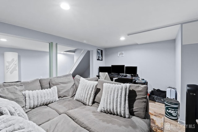 living area with recessed lighting and wood finished floors