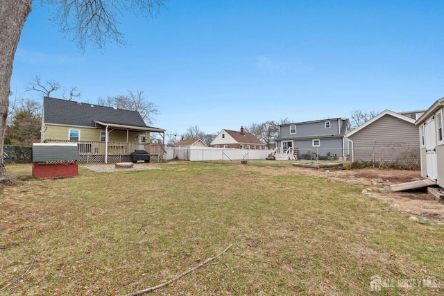 view of yard featuring a fenced backyard and a deck