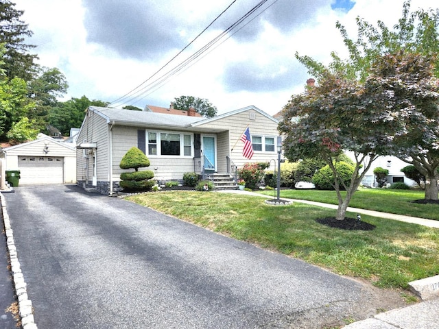 170 Hoover Ave, Edison, NJ 08837 - view of front facade featuring an outbuilding, a detached garage, asphalt driveway, and a front lawn