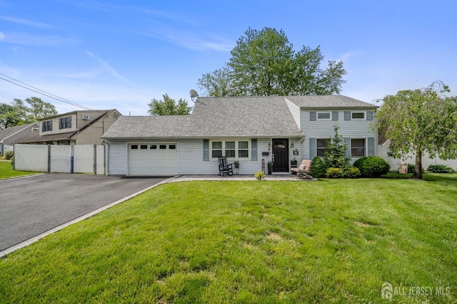 5 Wendy Rd, Woodbridge Proper, NJ 07067 - view of front facade featuring a garage and asphalt driveway