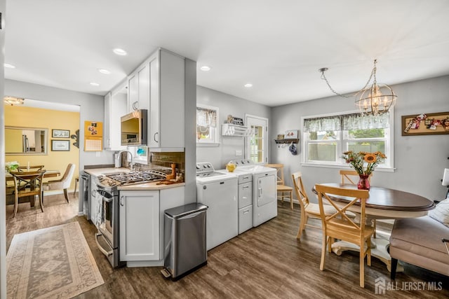 5 Wendy Rd, Woodbridge Proper, NJ 07067 - kitchen with washer and dryer, gas stove, dark wood finished floors, a chandelier, and recessed lighting