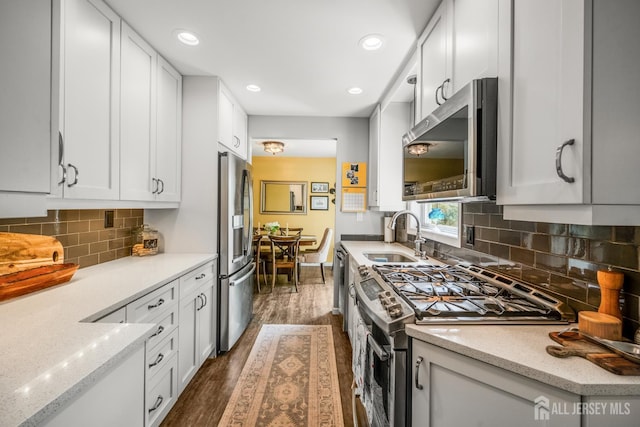 5 Wendy Rd, Woodbridge Proper, NJ 07067 - kitchen featuring stainless steel appliances, a sink, dark wood-type flooring, white cabinetry, and recessed lighting