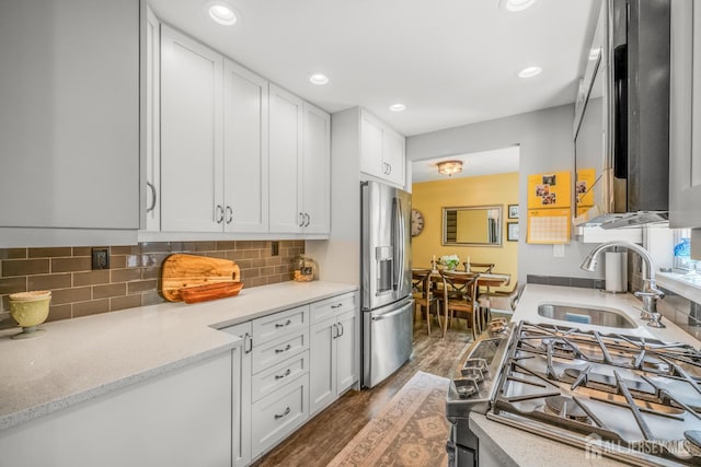 5 Wendy Rd, Woodbridge Proper, NJ 07067 - kitchen featuring stainless steel appliances, a sink, dark wood-type flooring, white cabinets, and decorative backsplash