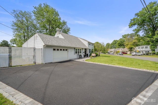 5 Wendy Rd, Woodbridge Proper, NJ 07067 - view of front of house featuring a garage, asphalt driveway, and roof with shingles