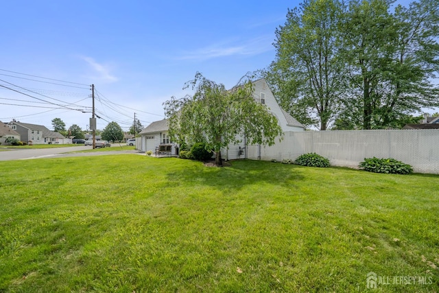 5 Wendy Rd, Woodbridge Proper, NJ 07067 - view of yard with asphalt driveway and a garage