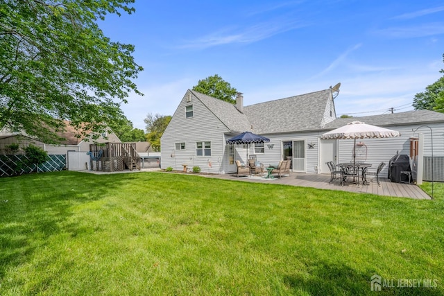 5 Wendy Rd, Woodbridge Proper, NJ 07067 - rear view of house with a chimney, a shingled roof, a deck, and a patio area