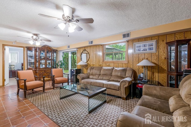 605 Beechwood Ave, Middlesex, NJ 08846 - tiled living area with a textured ceiling, ceiling fan, and wooden walls