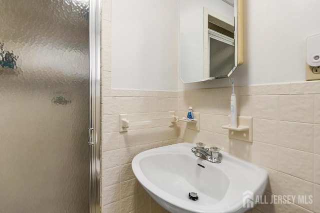 605 Beechwood Ave, Middlesex, NJ 08846 - full bath with a shower stall, tile walls, and wainscoting