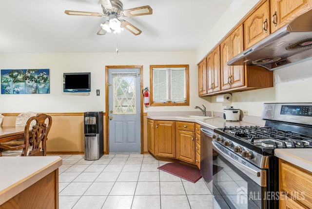 605 Beechwood Ave, Middlesex, NJ 08846 - kitchen with stainless steel gas stove, under cabinet range hood, light countertops, and a ceiling fan