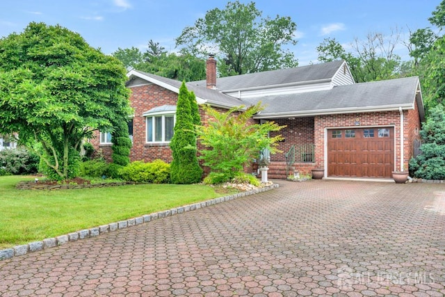 605 Beechwood Ave, Middlesex, NJ 08846 - view of front facade with an attached garage, a chimney, decorative driveway, brick siding, and a front yard